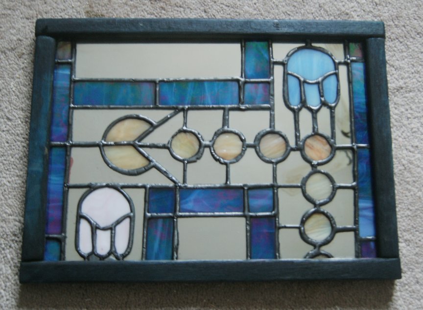 [Image: stained_glass_pac_man_mirror_in_art_deco...4su8h8.jpg]